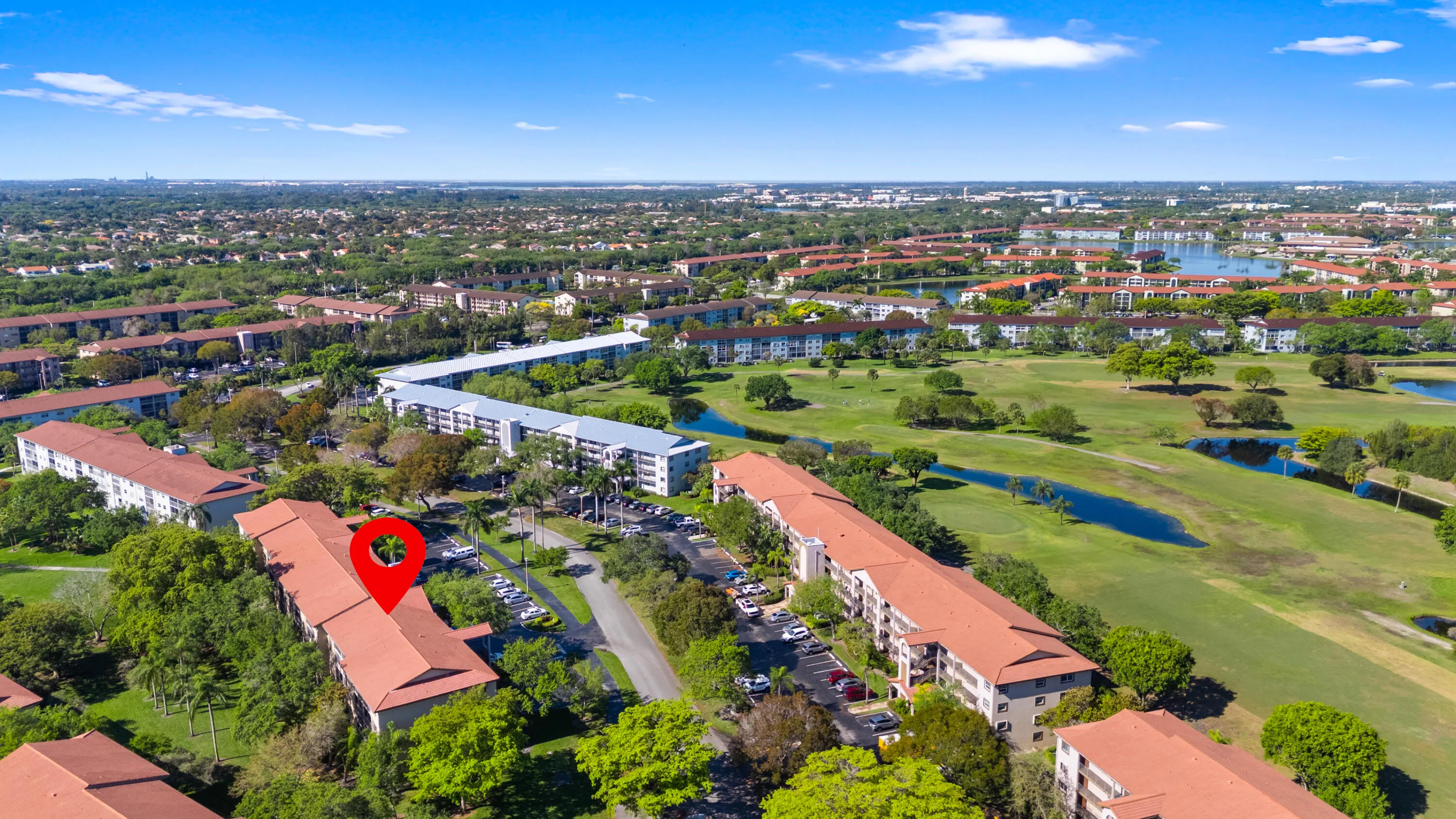 Expansive 55+ community with tree-lined streets, open green spaces, and a peaceful setting.