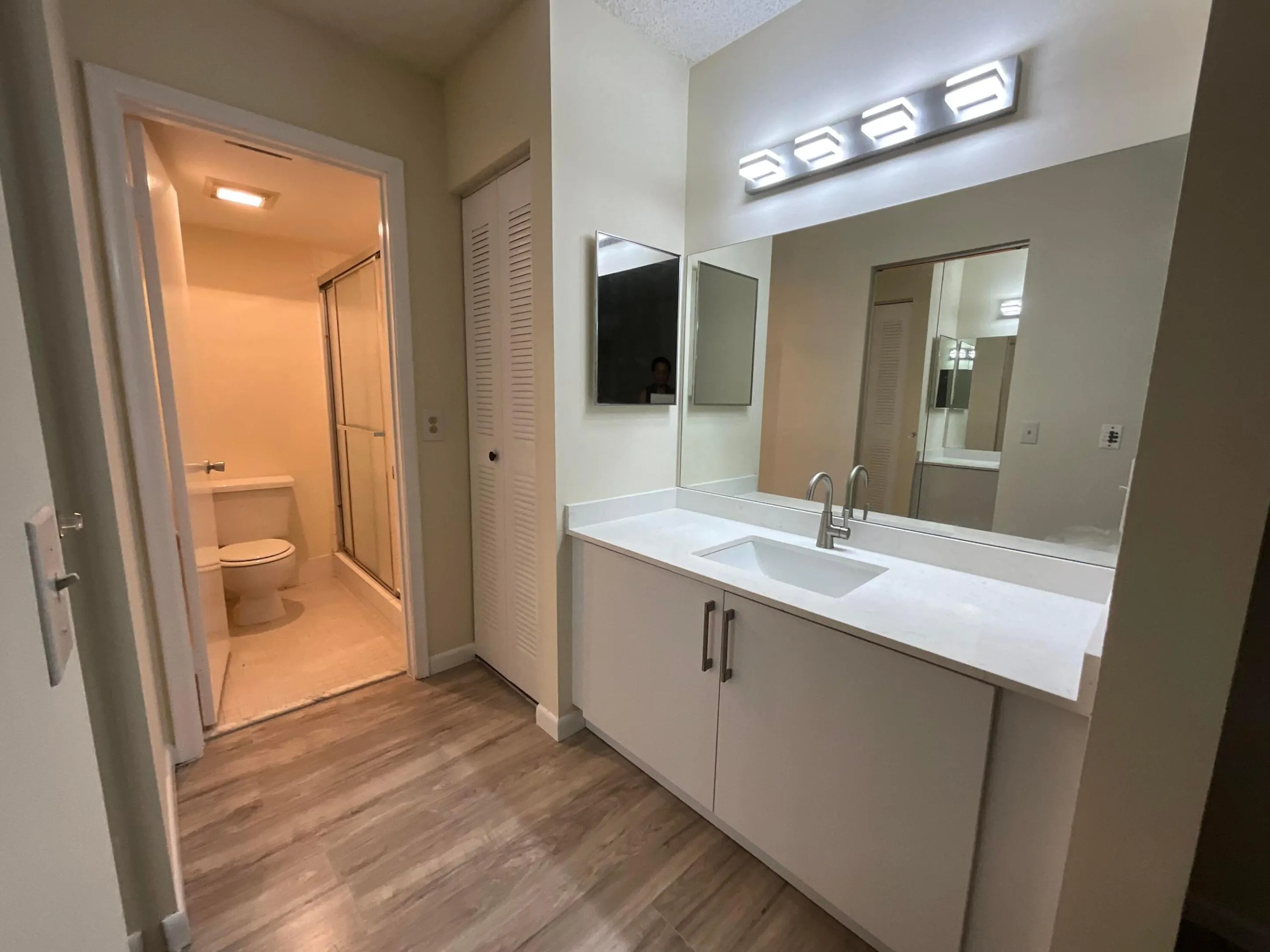 Both bathrooms feature new vanities with under-mount sinks and modern fixtures.