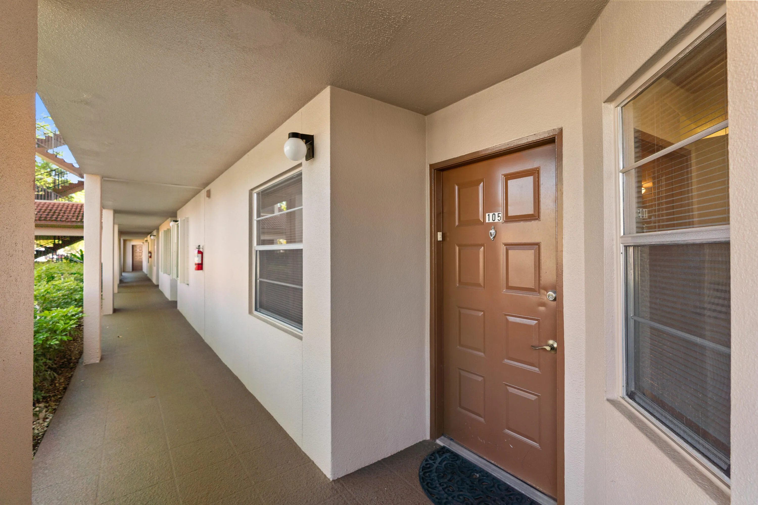 Welcoming entrance with covered access and convenient parking nearby.