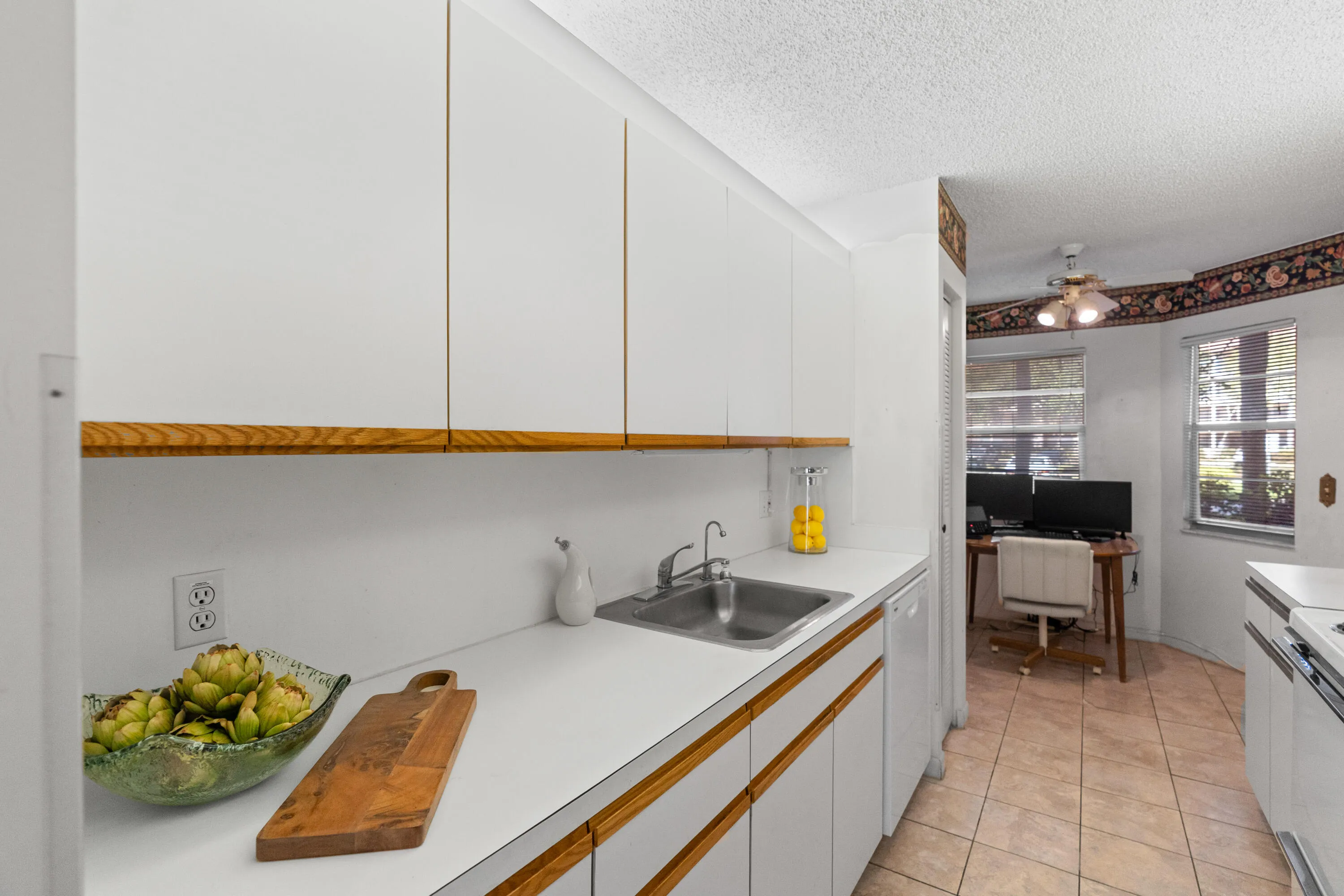 Stunning new kitchen with shaker cabinetry, quartz countertops & backsplash, new sink, faucet, flat cooktop stove/oven and microwave and a newer dishwasher and refrigerator.