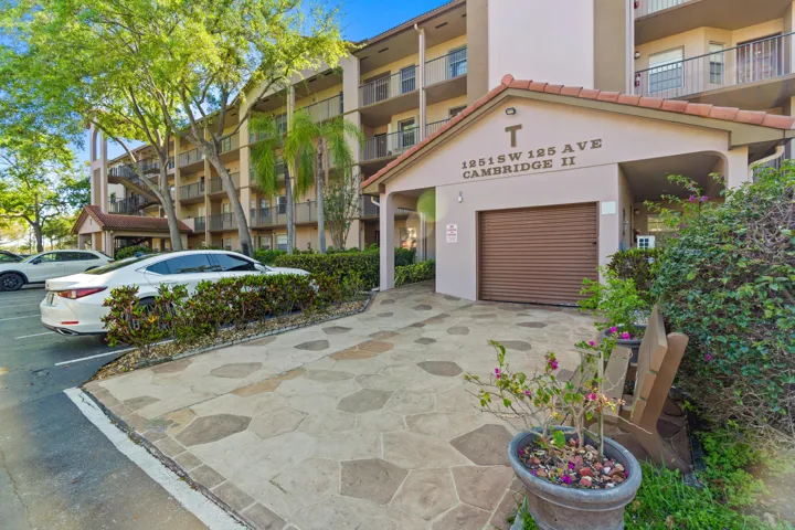 Beautifully updated 2 BD, 2 BA first-floor condo in Century Village! Recent improvements include new laminate flooring throughout, fresh interior paint, a completely renovated kitchen with new shaker-style cabinets, quartz countertops & backsplash, sink, faucet, and newer stainless steel stove & microwave.