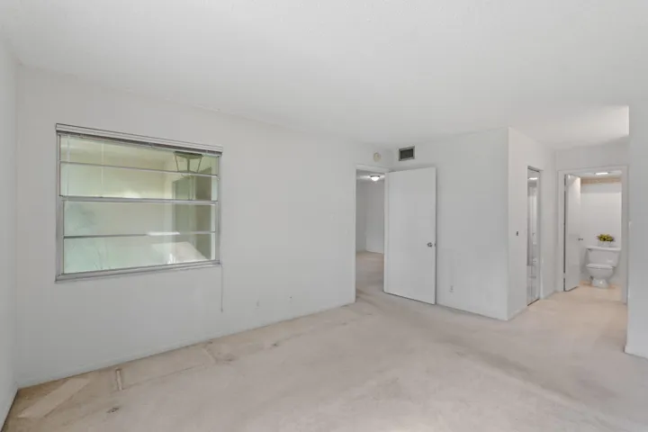 A spacious primary suite designed for comfort, privacy, and the opportunity to make it your own.