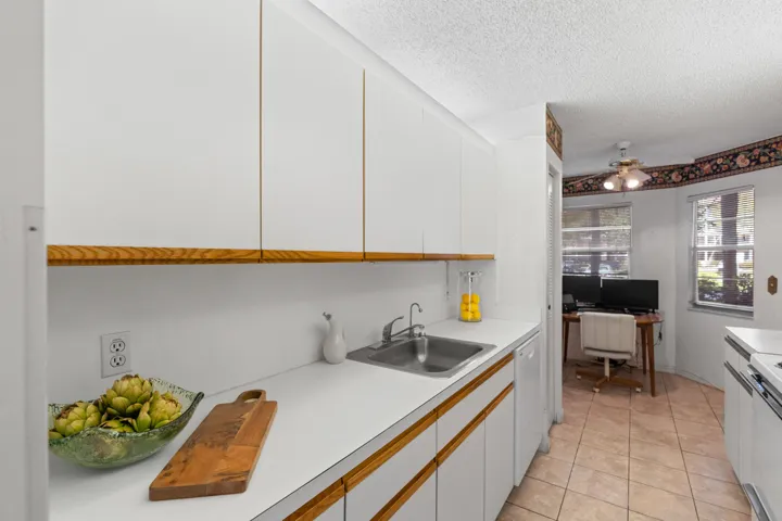 Stunning new kitchen with shaker cabinetry, quartz countertops & backsplash, new sink, faucet, flat cooktop stove/oven and microwave and a newer dishwasher and refrigerator.