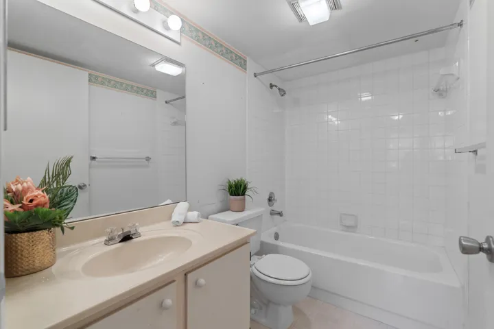 Clean and functional bathroom with a full tub and shower combination.