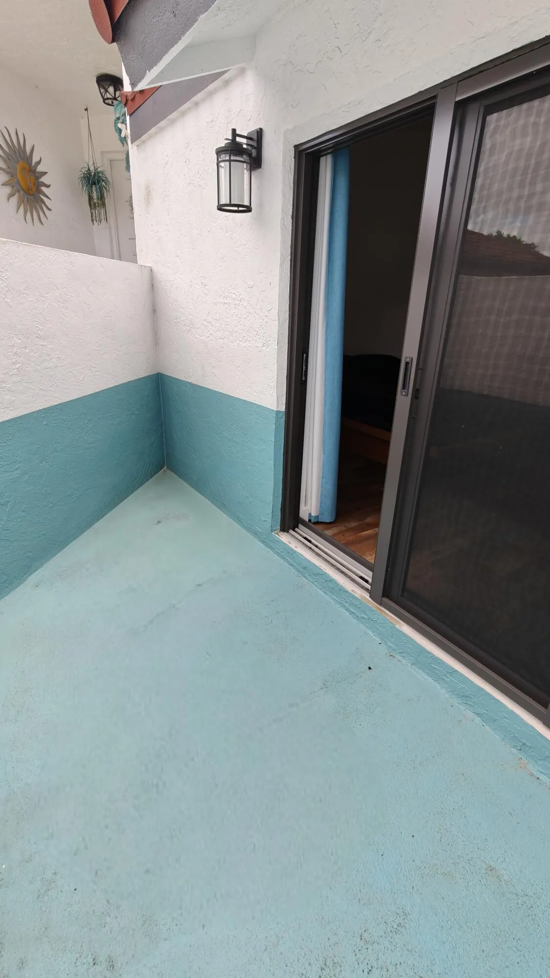 Enclosed patio adjacent to primary bedroom