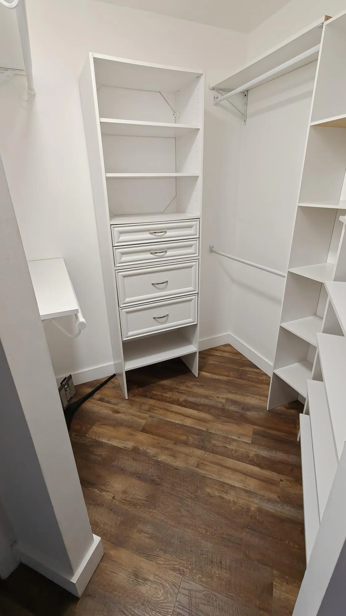 Primary bedroom walk-in closet