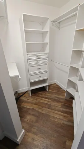 Primary bedroom walk-in closet