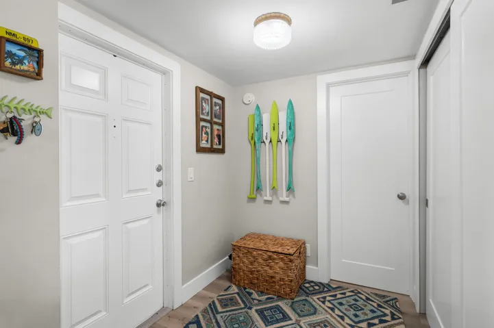 Foyer features a storage closet and opens to the guest bathroom.