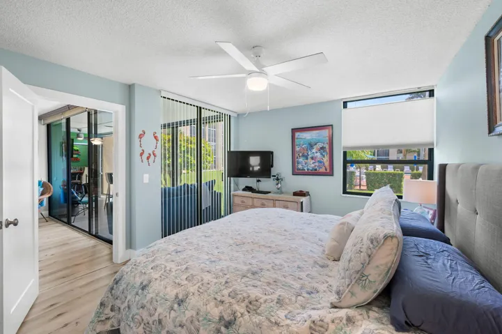Primary Bedroom opens to patio and overlooks the family room.