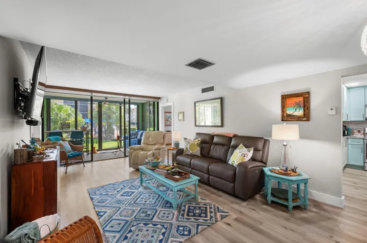 Family Room over looks Florida room and community pool.