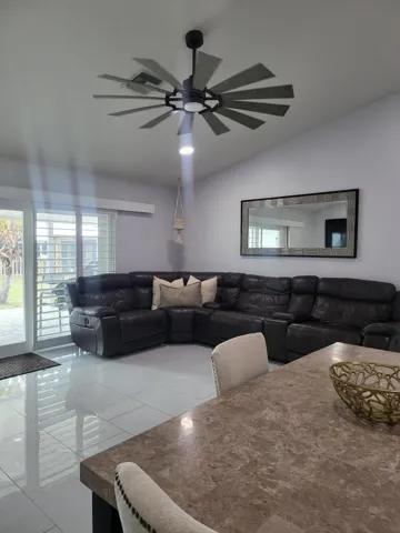 LIVING ROOM AREA/DINING OPEN TO PATIO