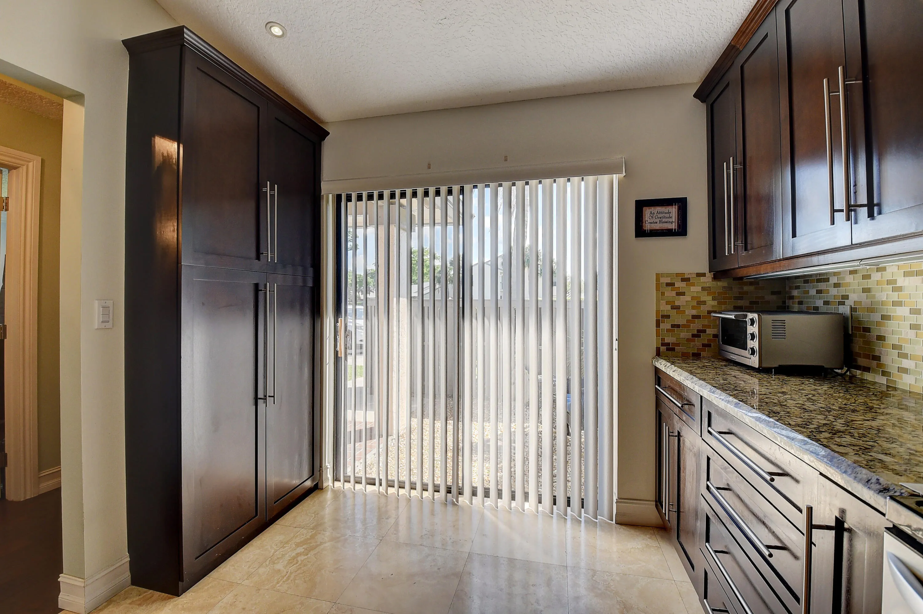 Kitchen, pantry, slider doors to front yard