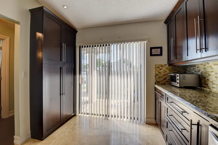 Kitchen, pantry, slider doors to front yard