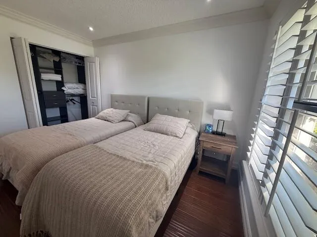 Guest Bedroom has california closet, plantation shutter
