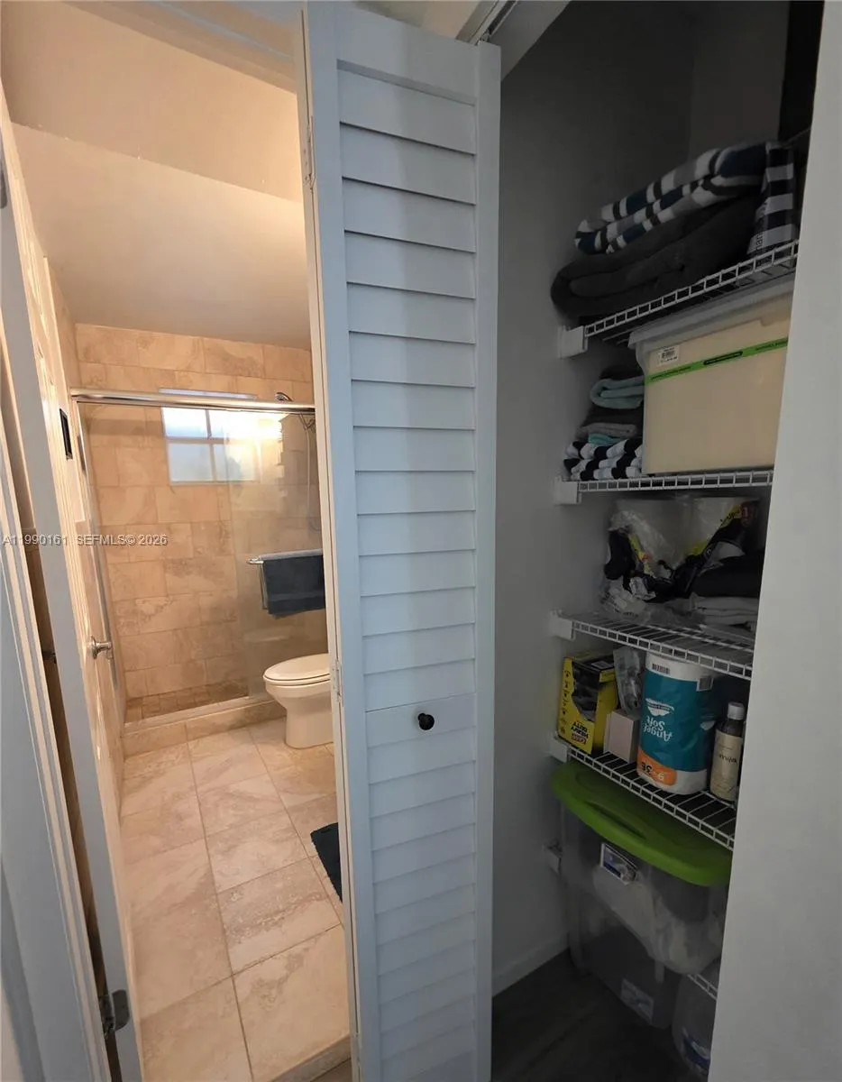 Storage/linen closet next to guest bathroom
