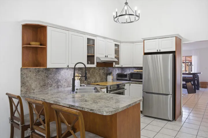 Step inside to bright, open living areas with abundant natural light, complemented by a practical kitchen and well-sized bedrooms.