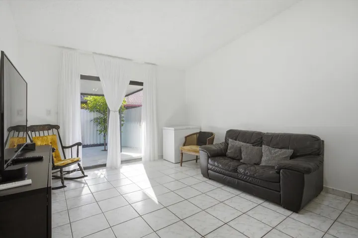 Step inside to bright, open living areas with abundant natural light, complemented by a practical kitchen and well-sized bedrooms.
