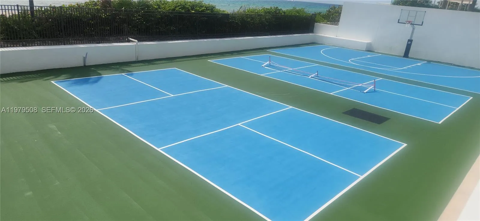 2 PICKLE BALL COURTS AND BASKETBALL COURT.