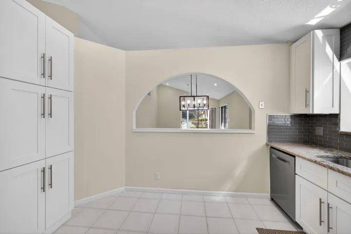 Archway cutout to dining / living room