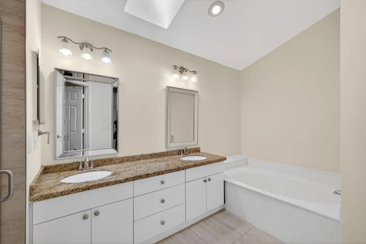 Dual Sink with granite, Tub, Step Down Shower