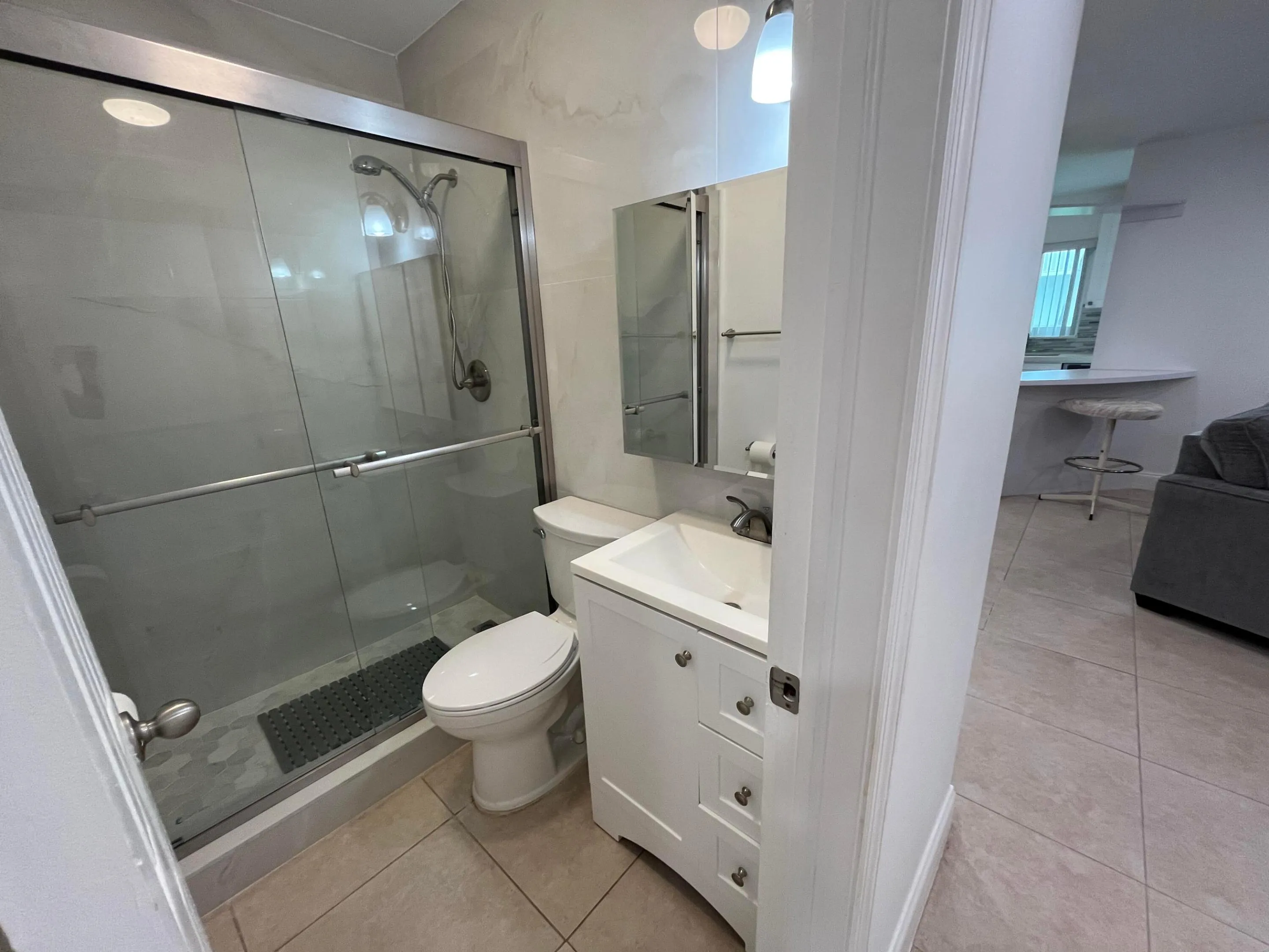 Completely updated second full bathroom with frameless shower doors