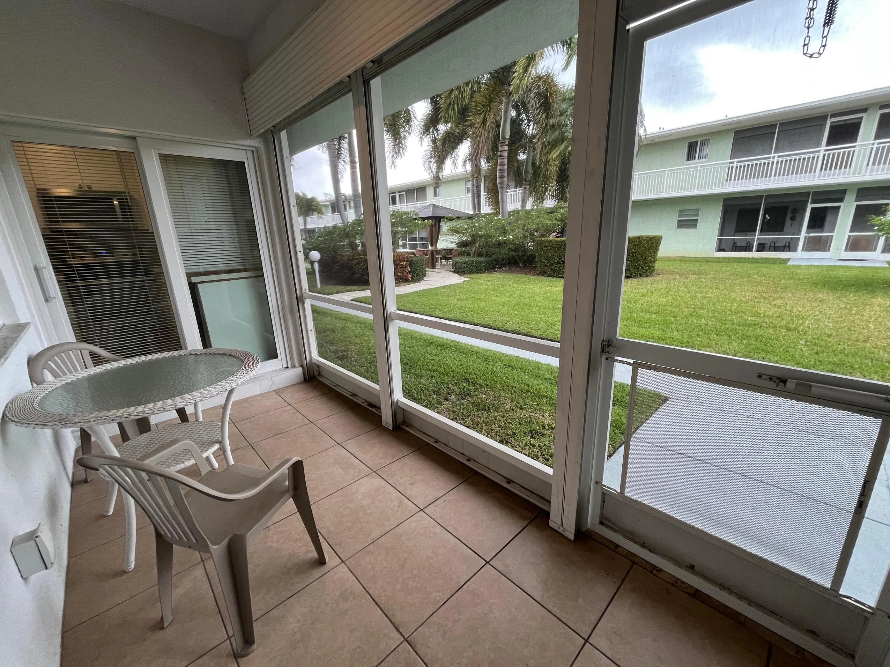 View of the courtyard from spacious screened in patio