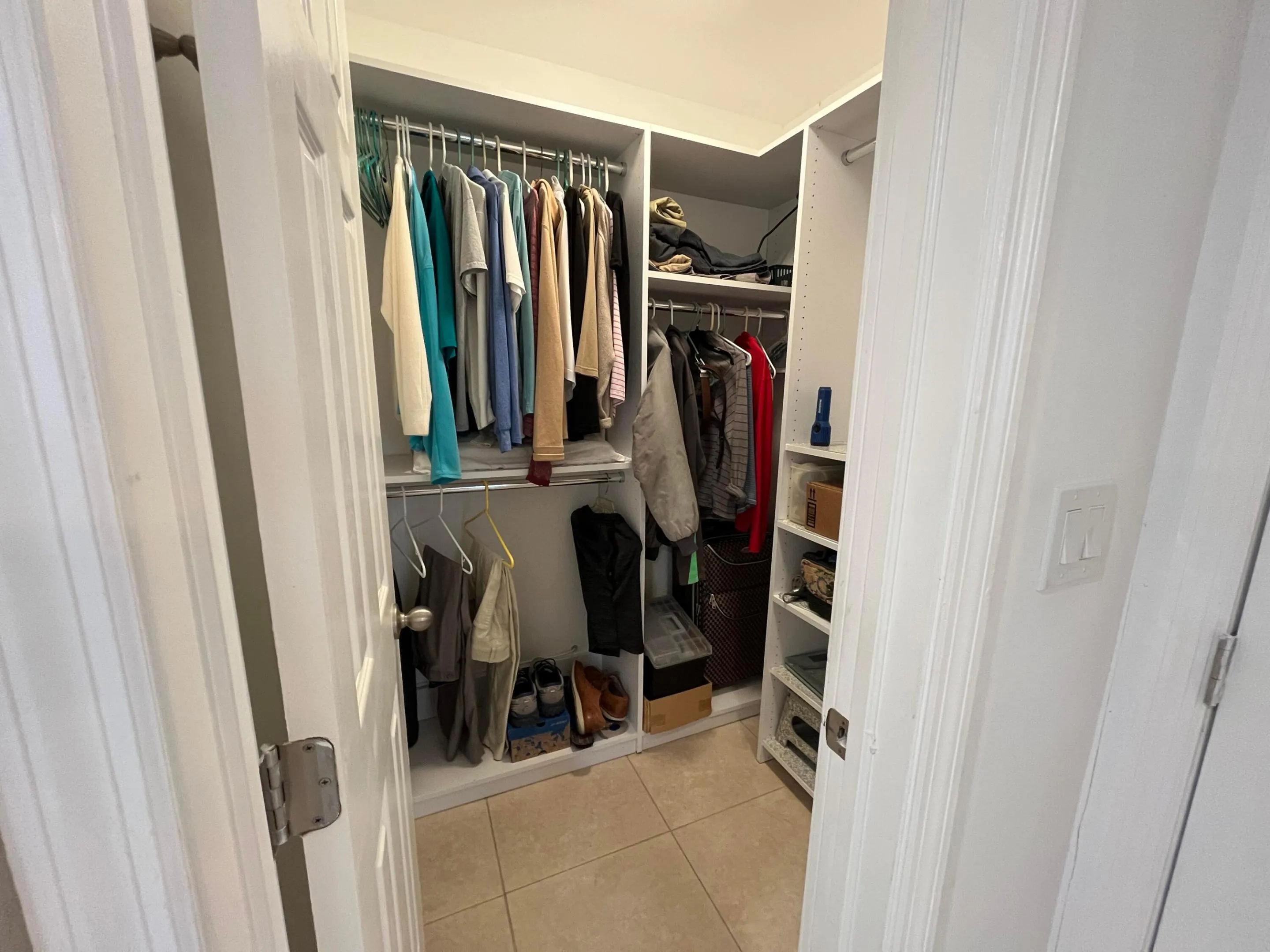Primary walk in closet with built-ins