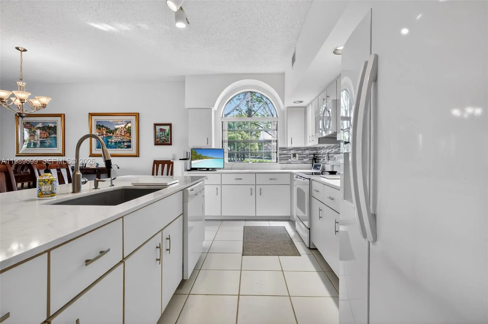 This home features oversized windows, elevated ceilings