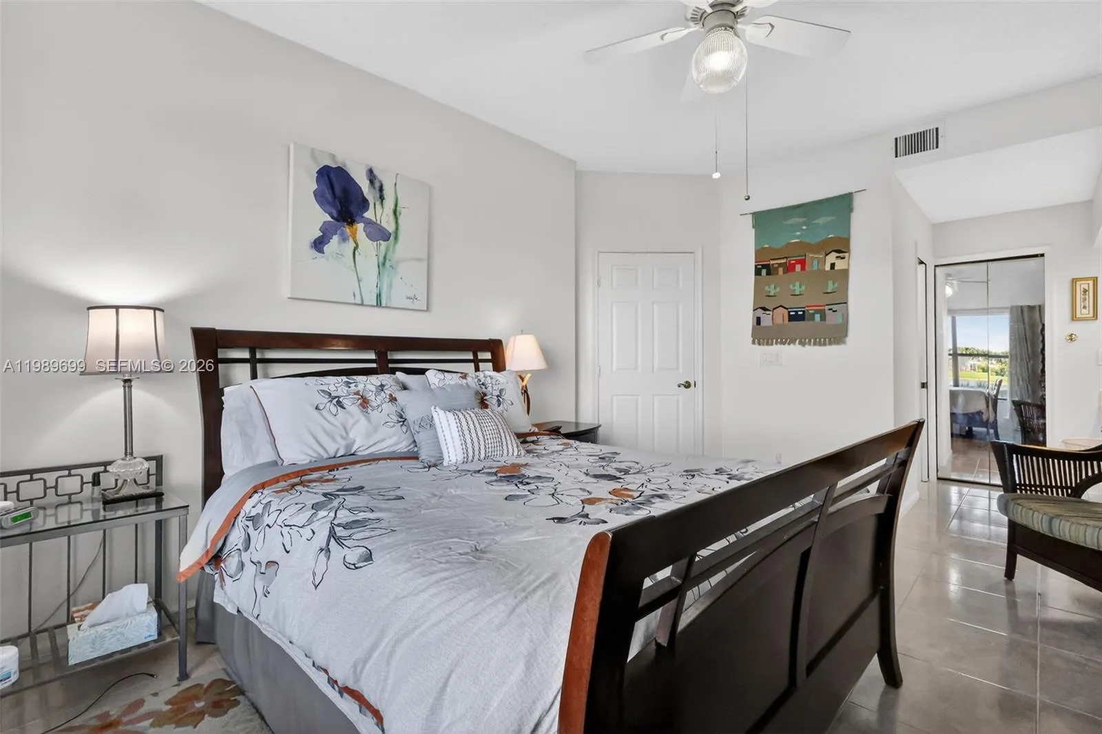The primary suite offers a large walk-in closet and picturesque views