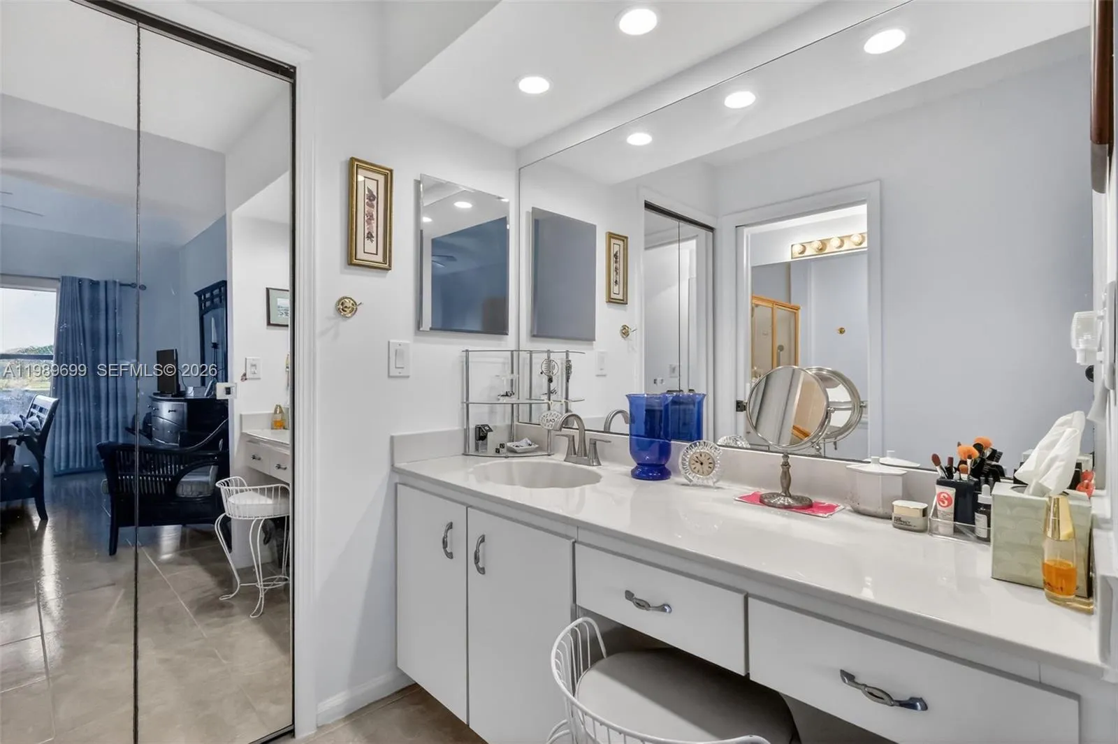 Ensuite bathroom, walk-in closet, and vanity