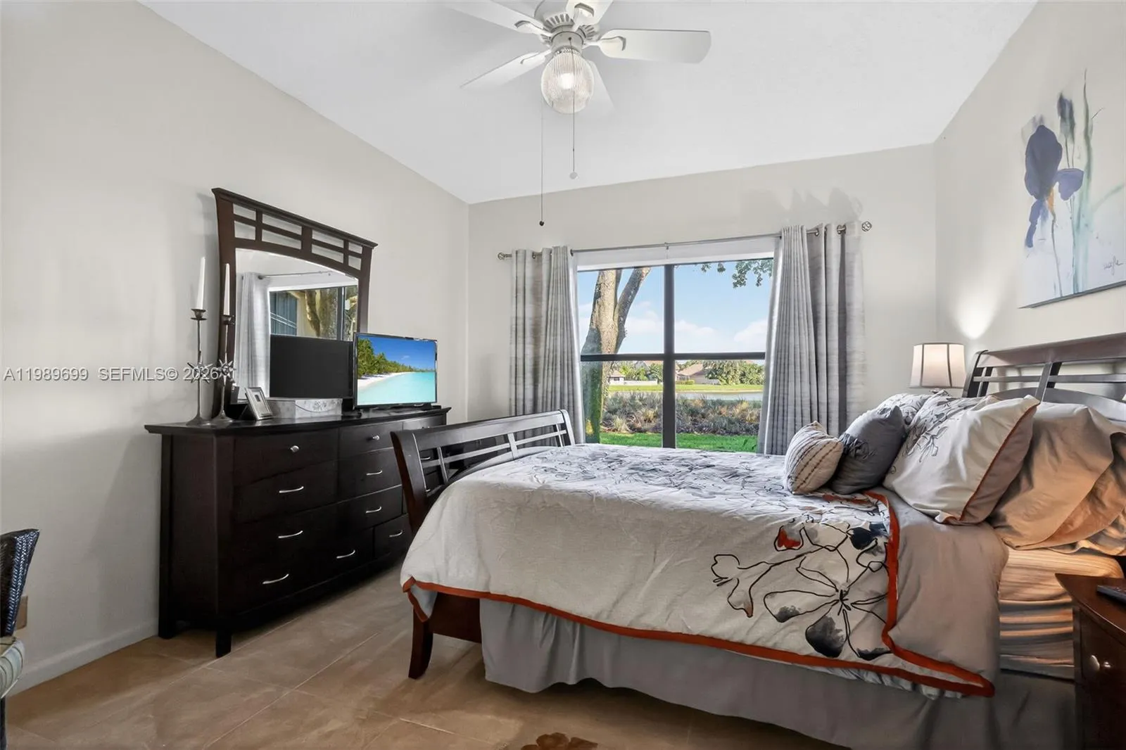 The primary suite offers a large walk-in closet and picturesque views