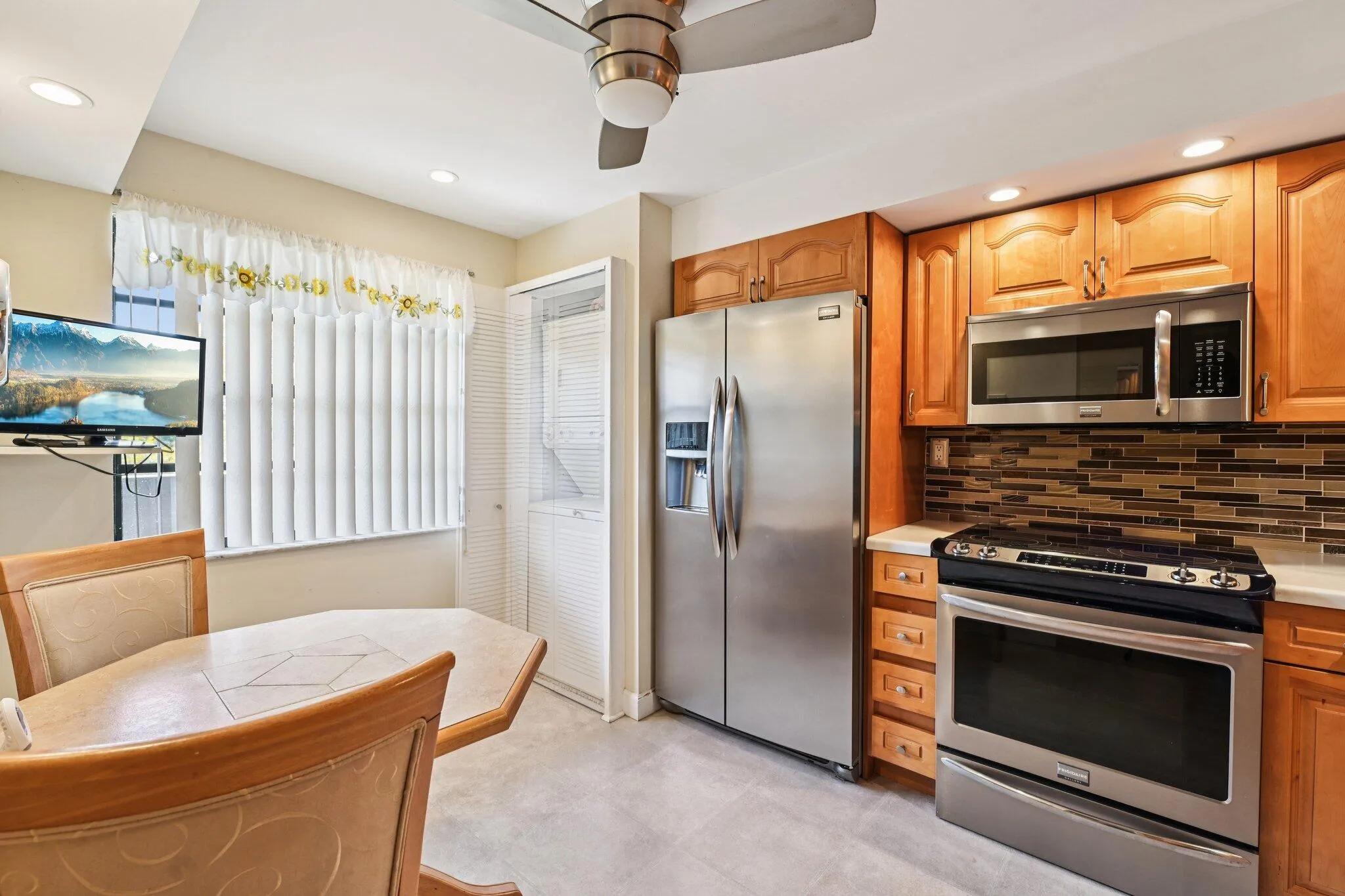 Beautifully remodeled dine-in kitchen with stainless steel appliances