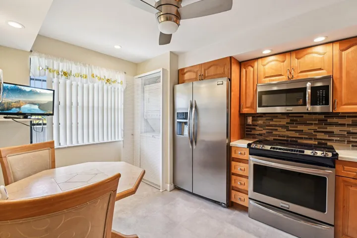 Beautifully remodeled dine-in kitchen with stainless steel appliances