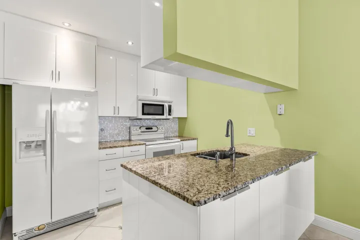 Updated Kitchen with pot drawers, spice drawer and cabinets on both sides of the island.