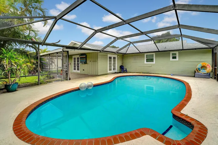 Screened in pool with new pump.