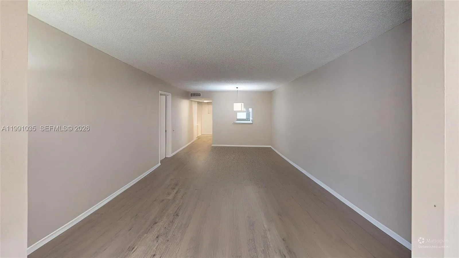 as defurnished, looking towards front door