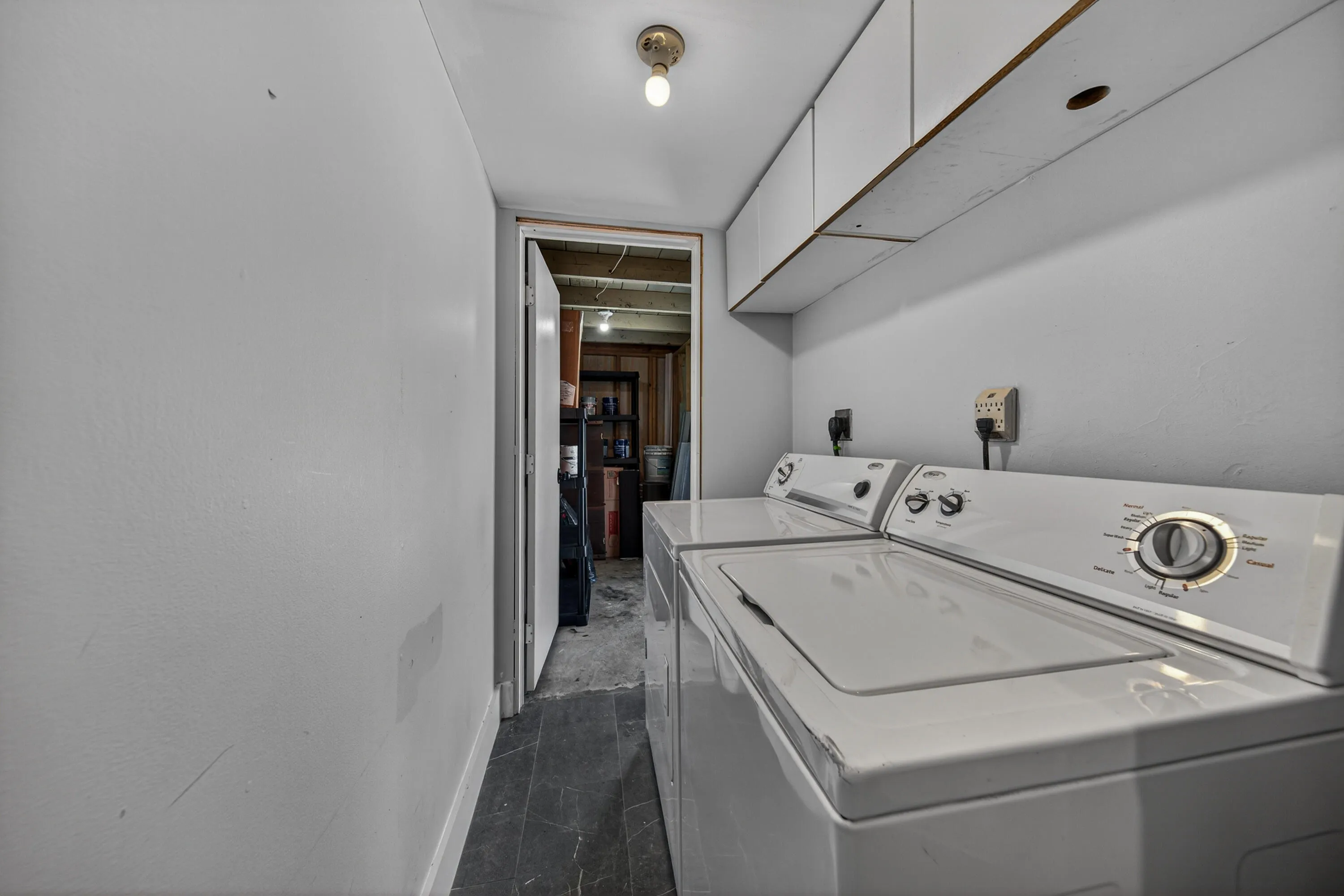 Laundry has door to outside carport and huge outdoor closet for additional storage.