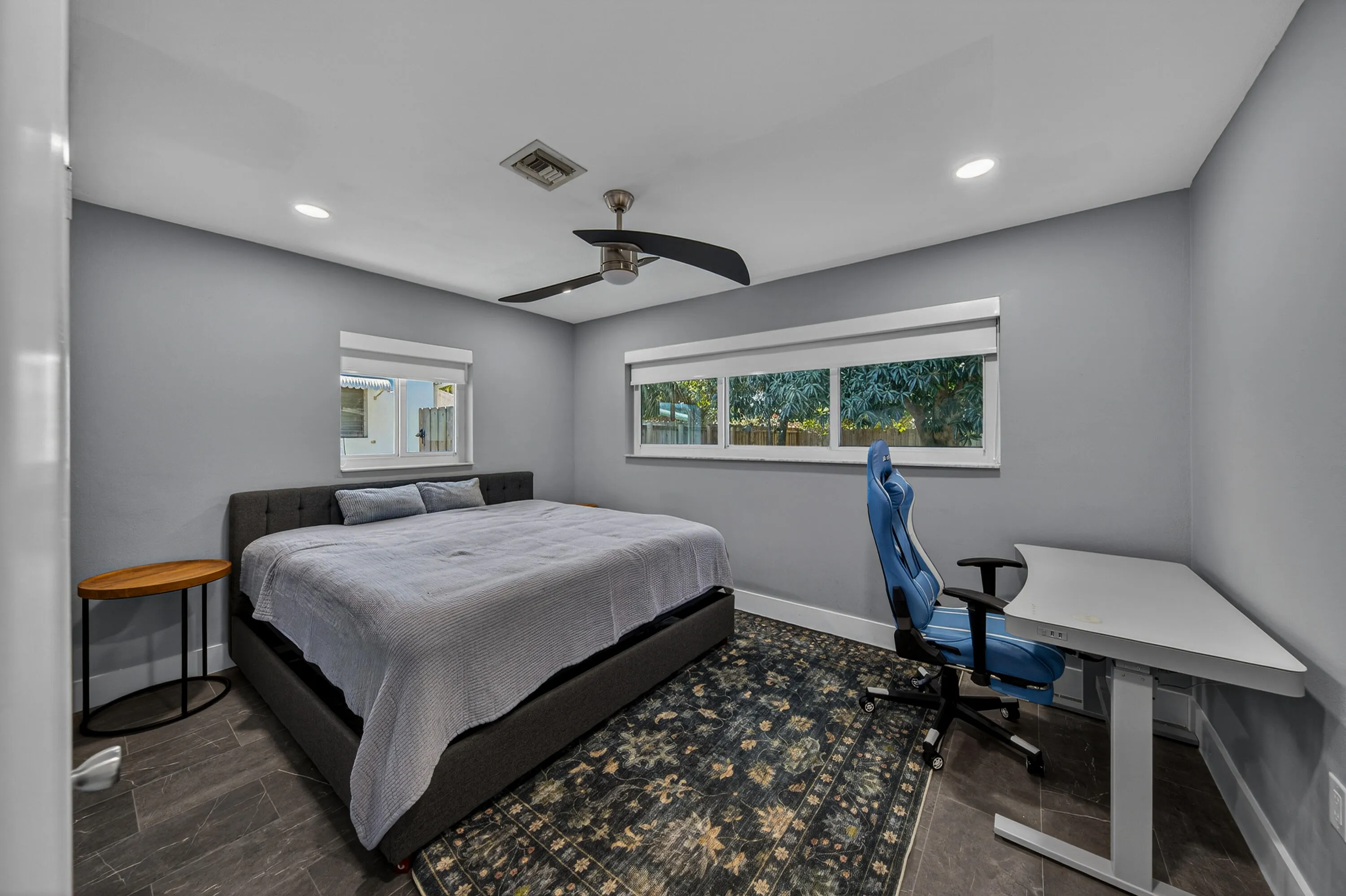 Spacious primary bedroom large enough to accommodate a king size bed.