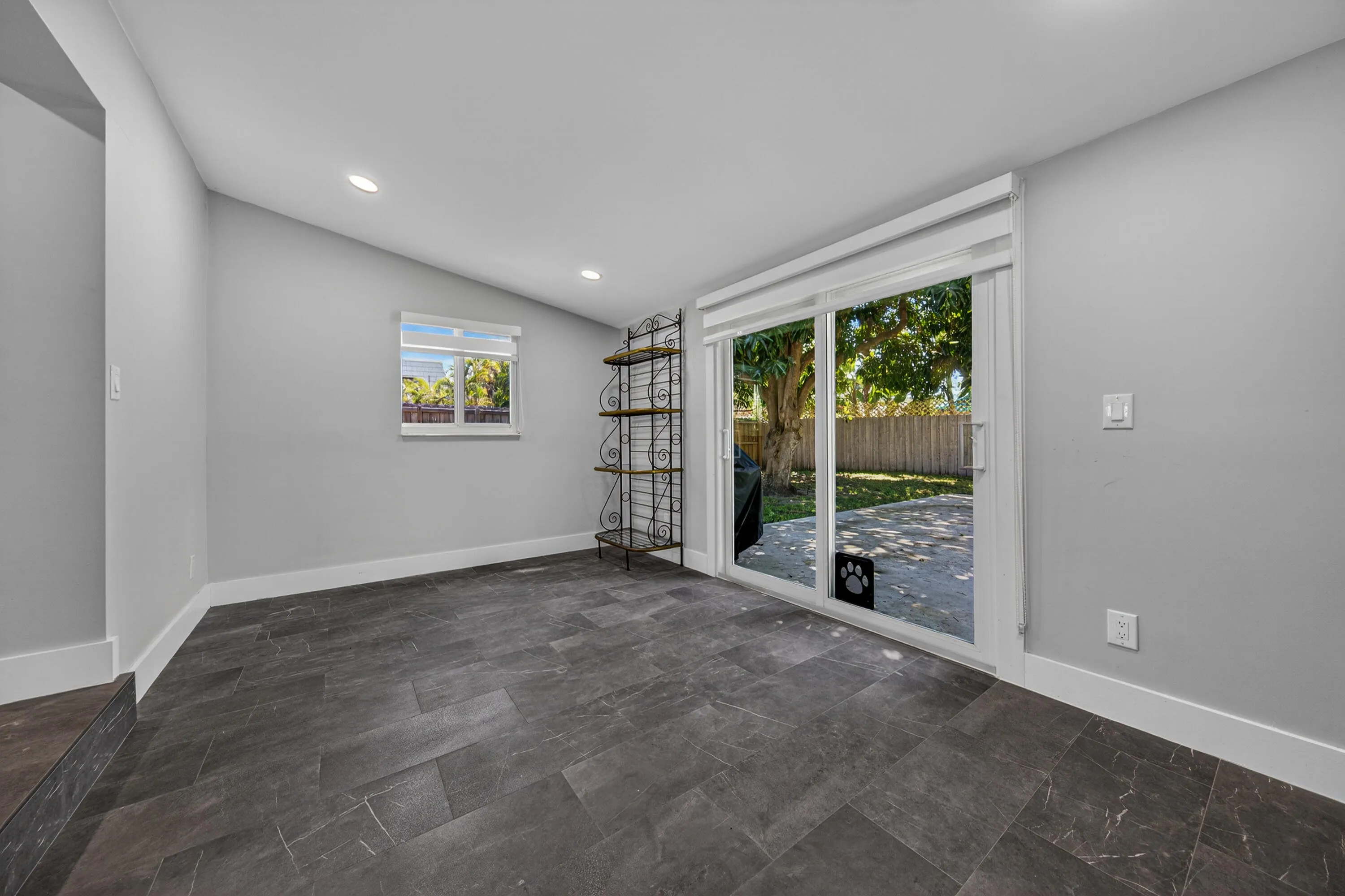 Step down into a large den off living room dining room.