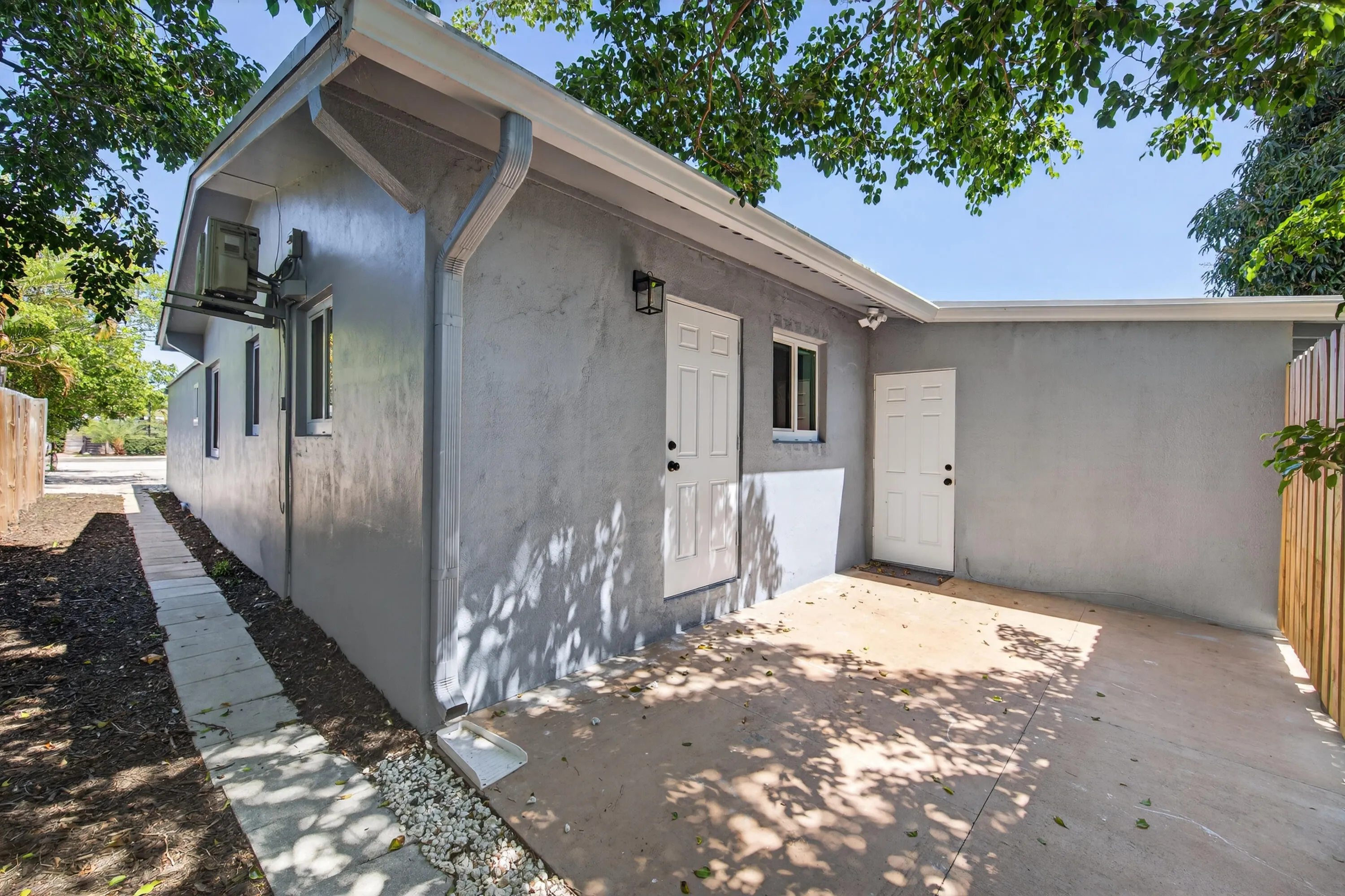 Efficiency in the back with private entrance, private patio, kitchenette with microwave, one bedroom and bathroom.