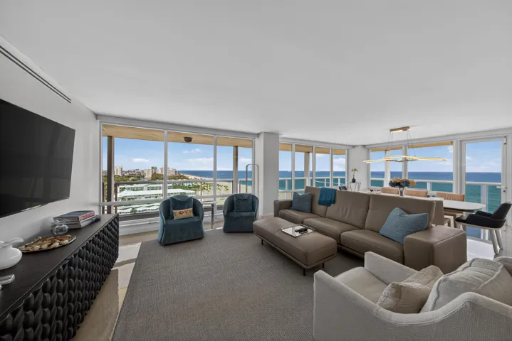 Huge Living Room / Dining room with breathtaking views of the Ocean and City.