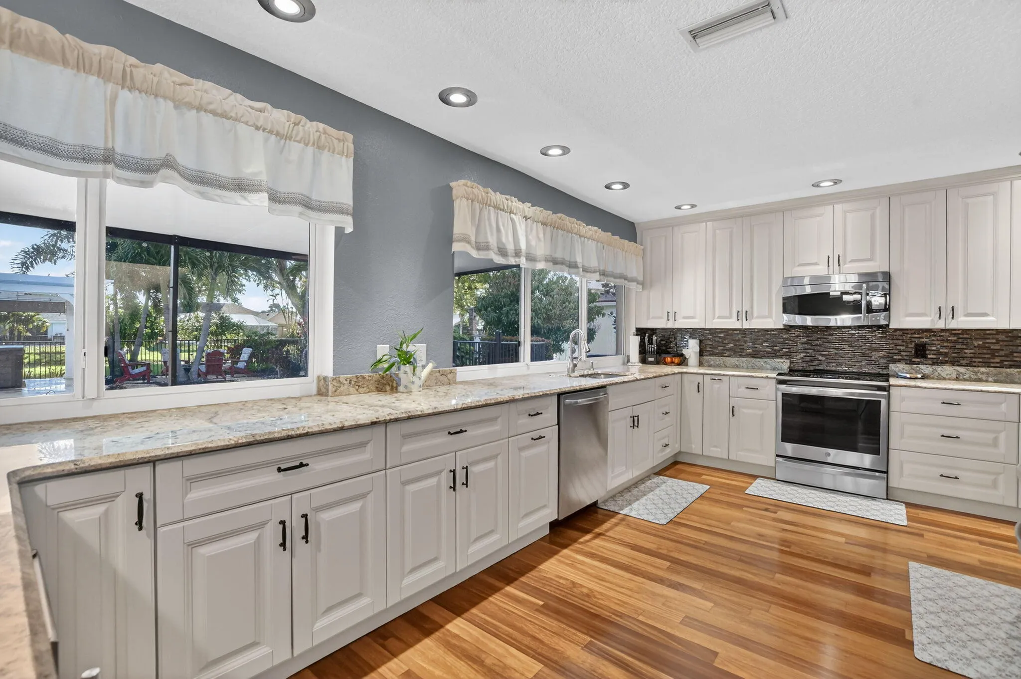 Kitchen w/window overlooking pool/patio