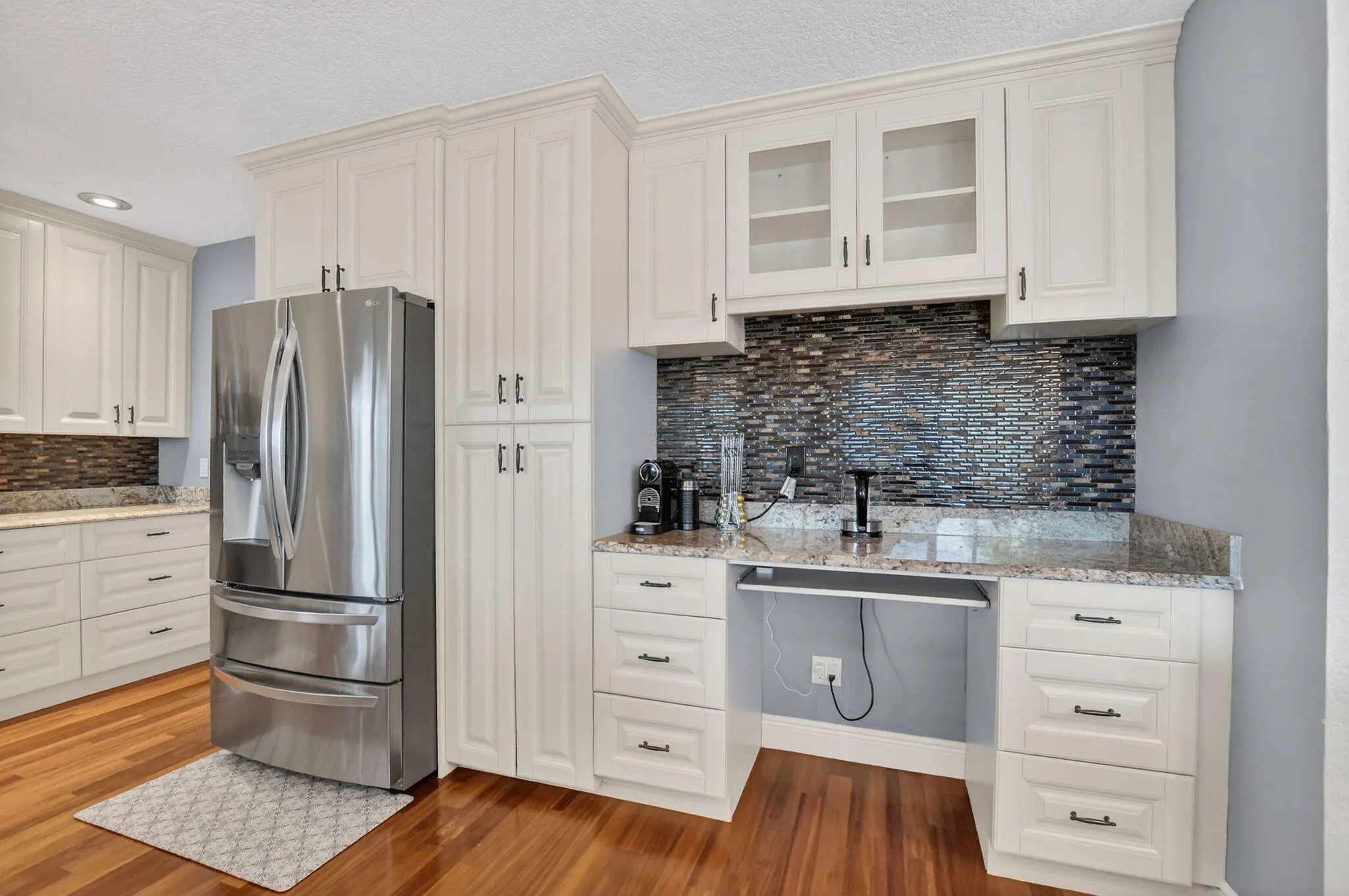 Stainless Steel refrigerator, pantry, coffee/desk area