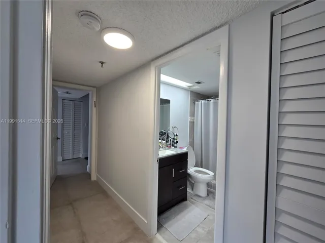 HALL/FIRST BEDROOM