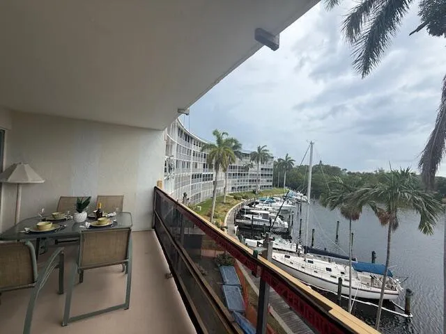 Screened balcony wraps around the full width of the apartment