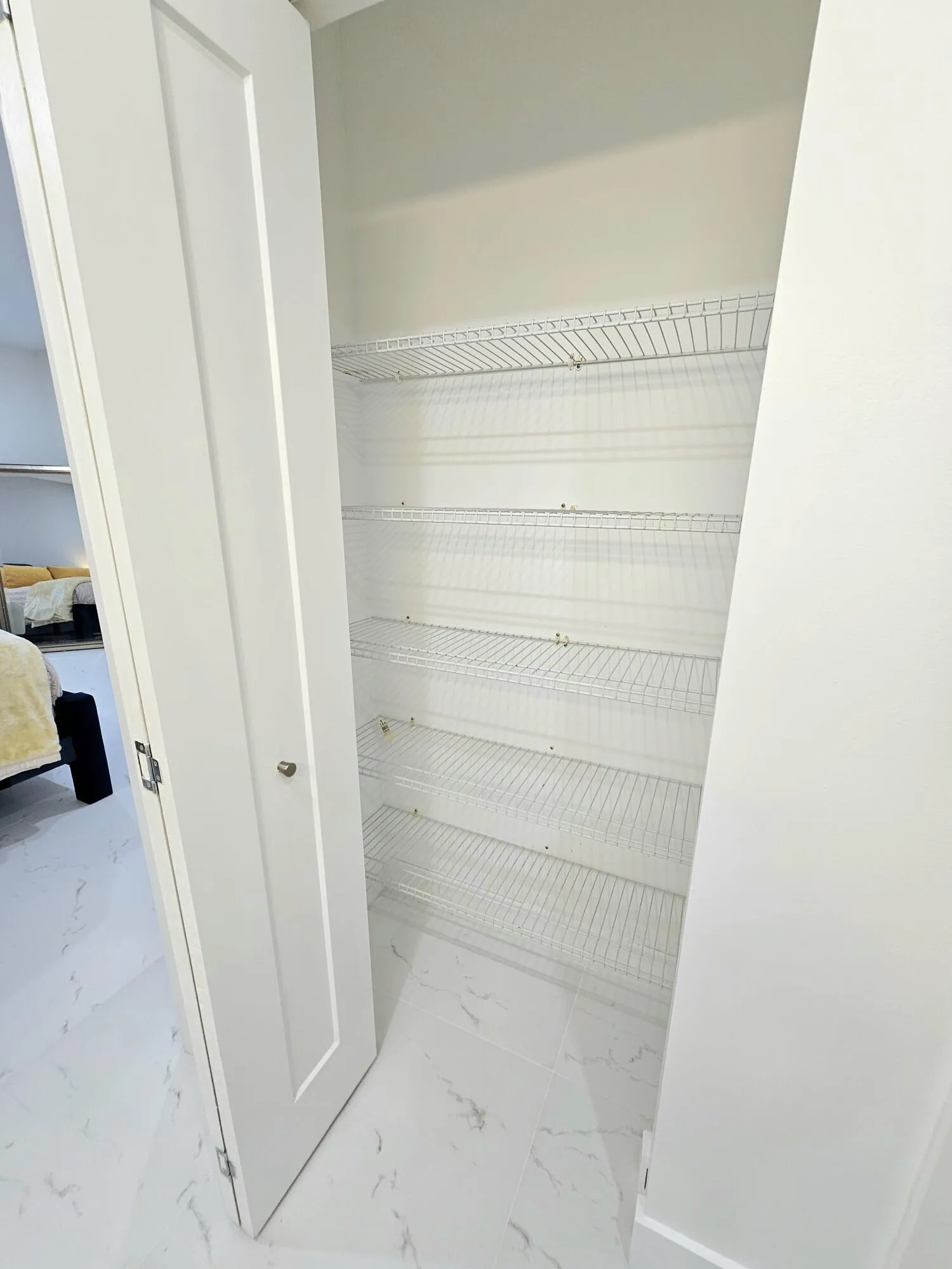 Linen Closet with New Shaker Bi-Fold Doo