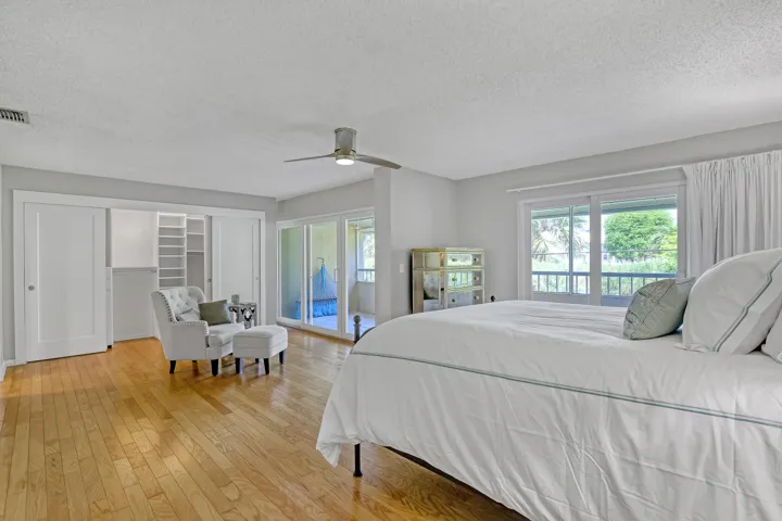 Spacious primary suite , California Closets, sitting area , private balcony, Expanded storage in primary bathroom