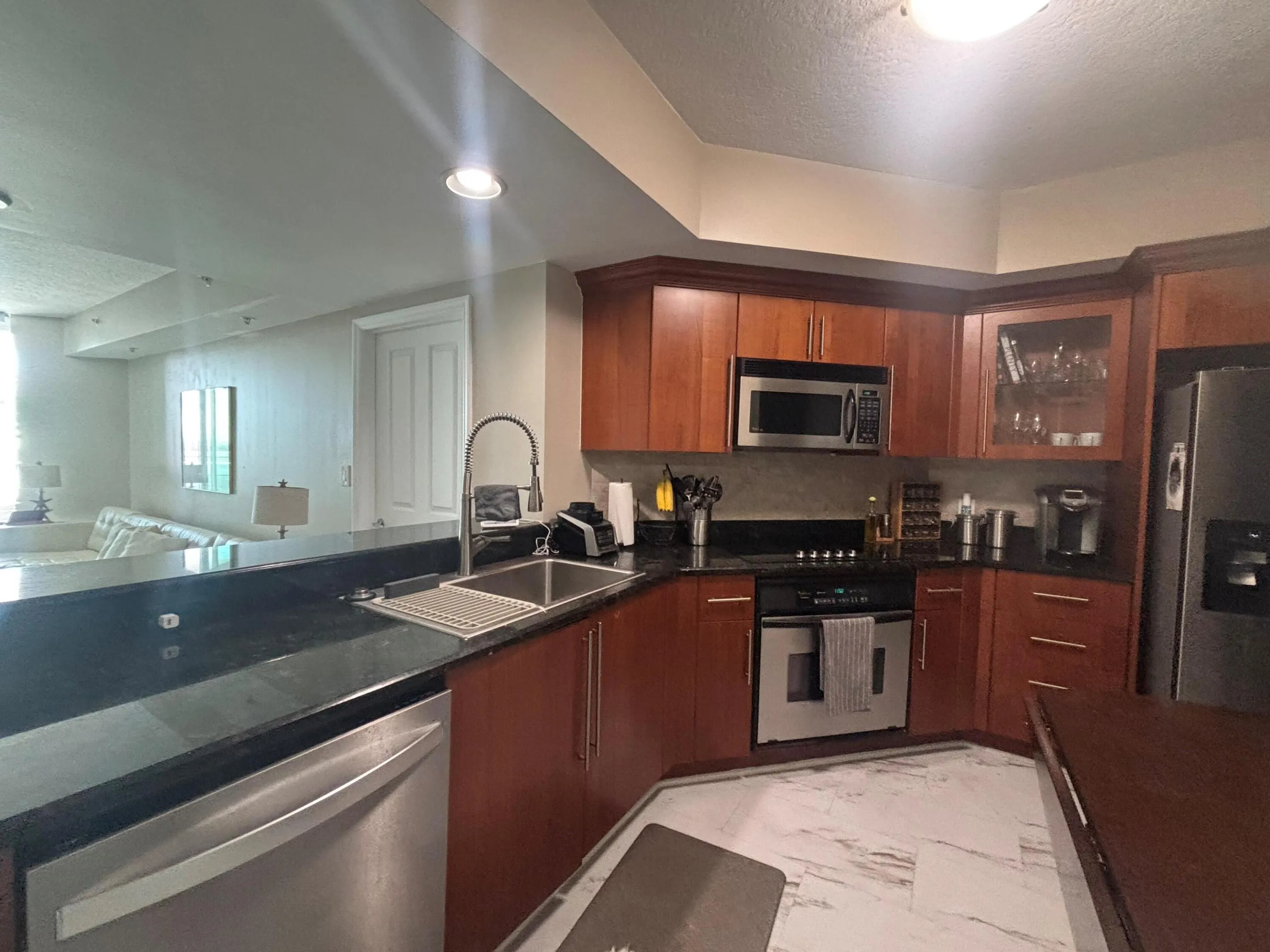 Stainless Appliances, granite counters, wood cabinets