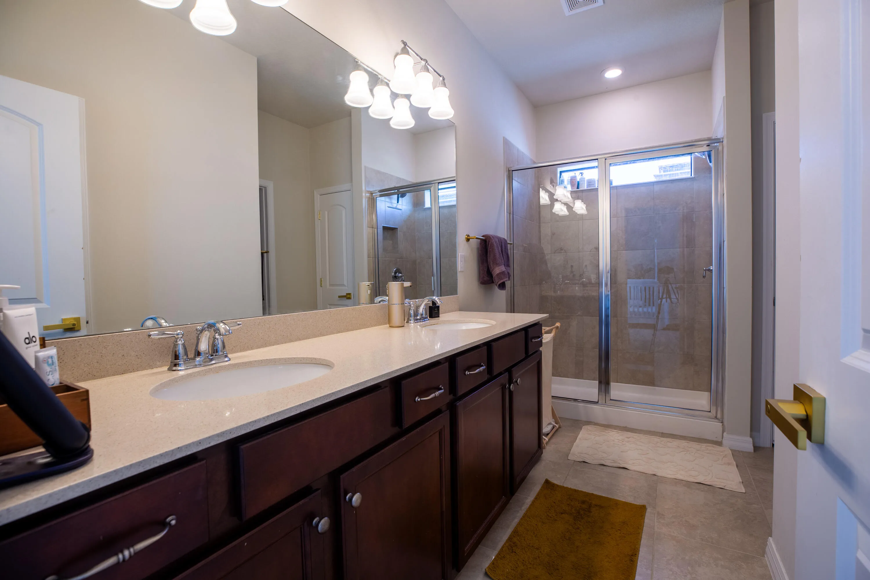 Primary bathroom with dual vanities