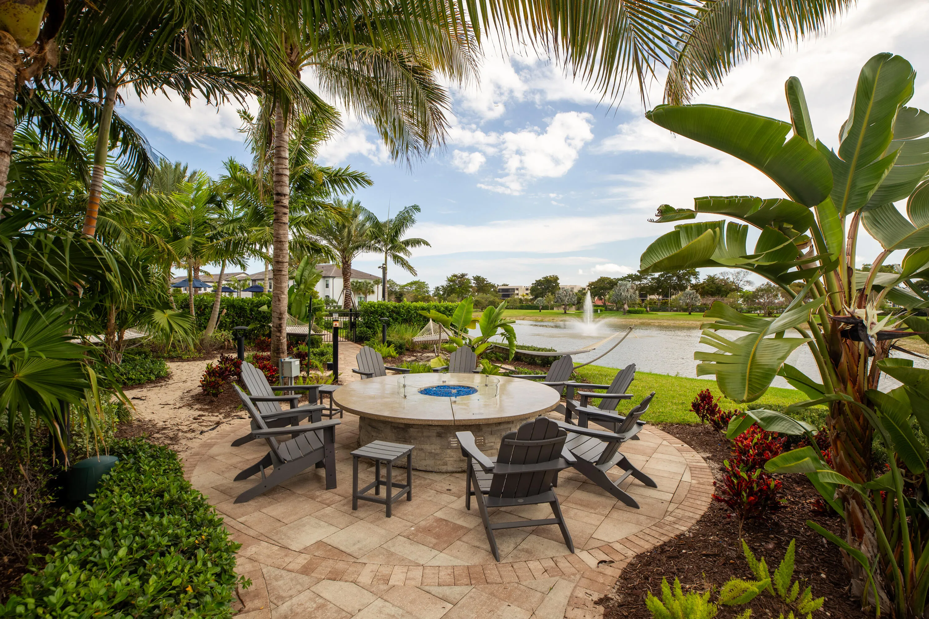 Fire pit area with lake and fountain views